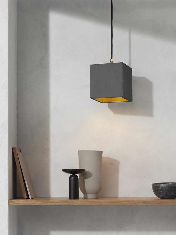 GANTlights B1 concrete pendant light with dark grey finish and copper accent